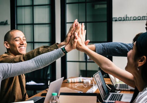 Group of people doing high five